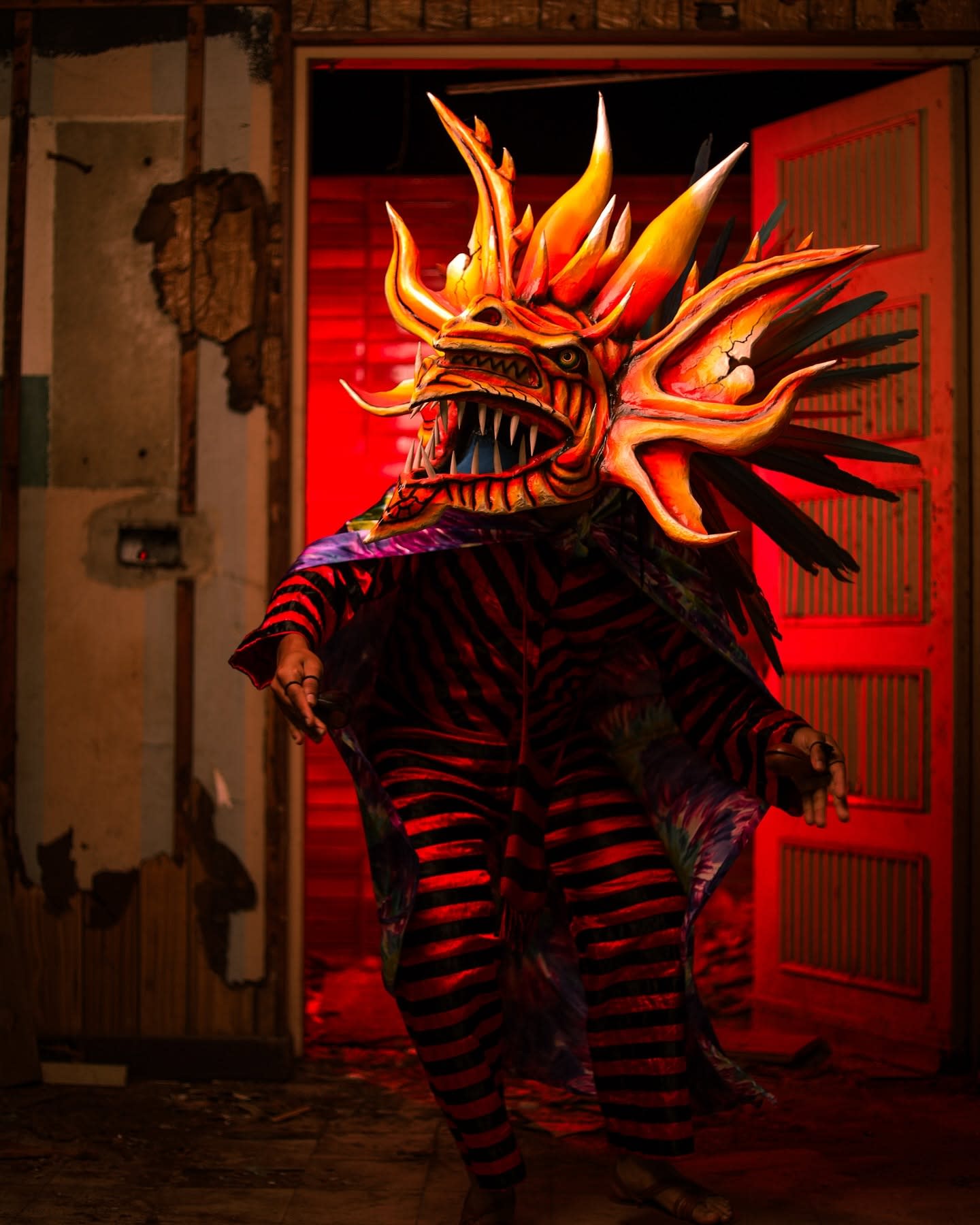 Jorge wearing a Diablicos mask and costume, a Panamanian folkloric tradition